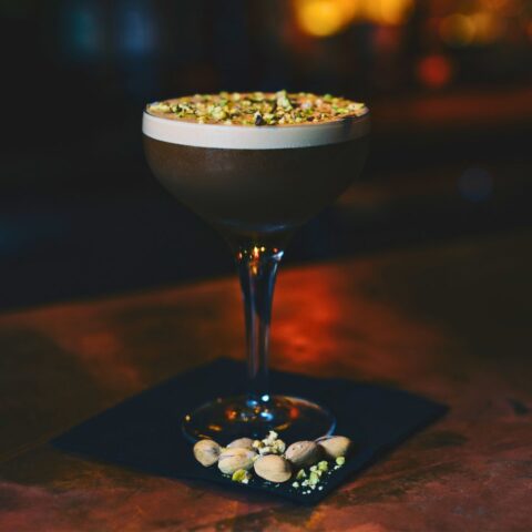 Chocolate Pistachio Espresso Martini in front of the fireplace
