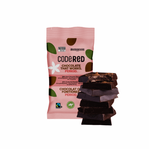 A red package of chocolate next to a stack of chocolate squares.