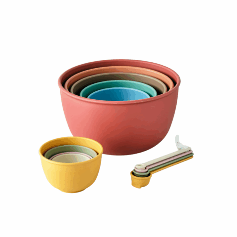 A nesting set of mixing bowls, a nesting set of measuring cups and a nesting set of measuring spoons.