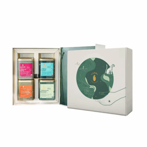 An open box displaying four different tea cannisters.