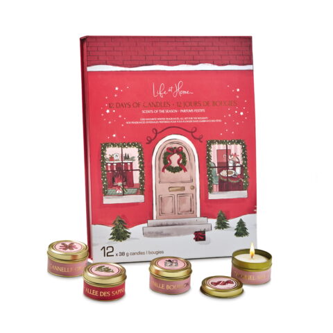 Four mini candles in front of a red advent calendar.