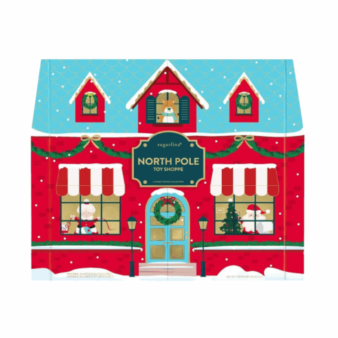 A paper box designed to look like a house decorated for the holidays.