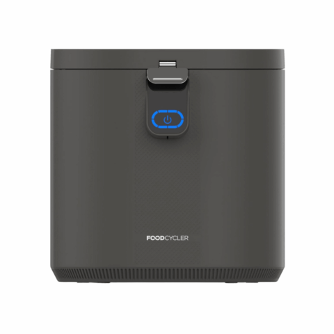 A black rectangular compost machine.