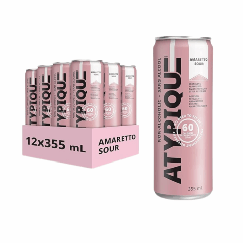 A pink case of twelve pink cans of non-alcoholic amaretto sour next to a solo can of the same drink.