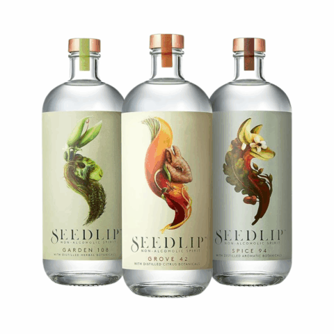 Three glass bottles filled with clear liquid and with light green labels.