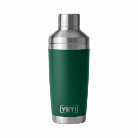 A silver cocktail shaker with a dark green core.