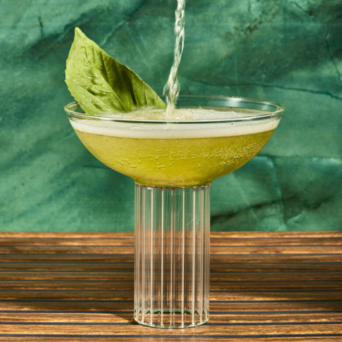 Refreshingly herbaceous Basil Spritz cocktail with Pink Peppercorn Syrup and Absinthe mist