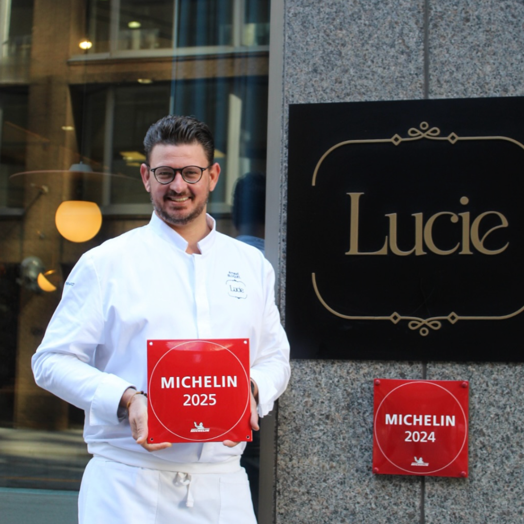 Chef Arnaud Bloquel standing outside Lucie Restaurant with michelin star