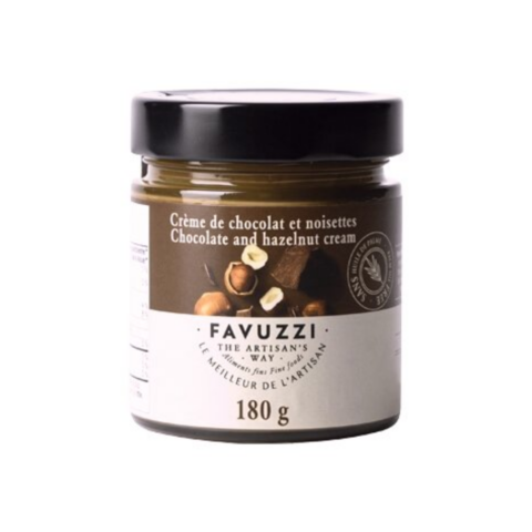 Jar of chocolate hazelnut spread with a black lid and brown and white label.