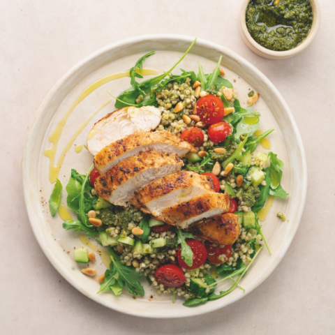 Grilled chicken on a healthy salad with buckwheat and pesto