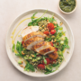 Grilled chicken on a healthy salad with buckwheat and pesto
