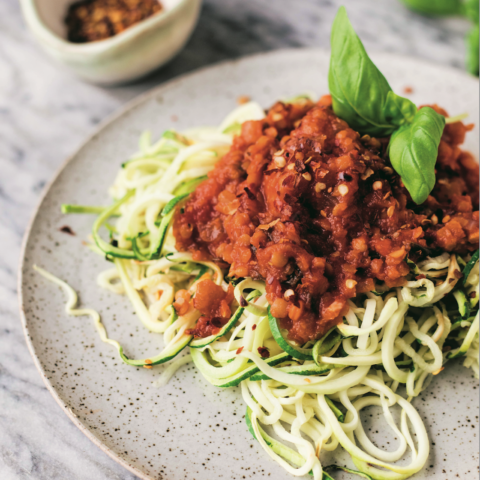 Lentil tomato sauce on a bed of zucchini noodles.