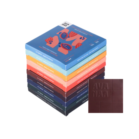 A square tablet of dark chocolate next to a stack of 10 square boxes.