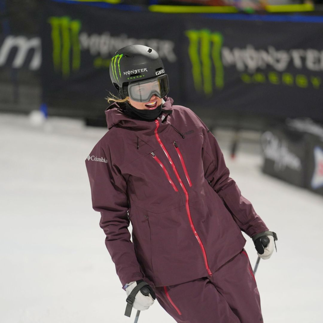 Cassie-Sharpe-Team-Canada-freestyle skier wearing a purple jacket and helmet