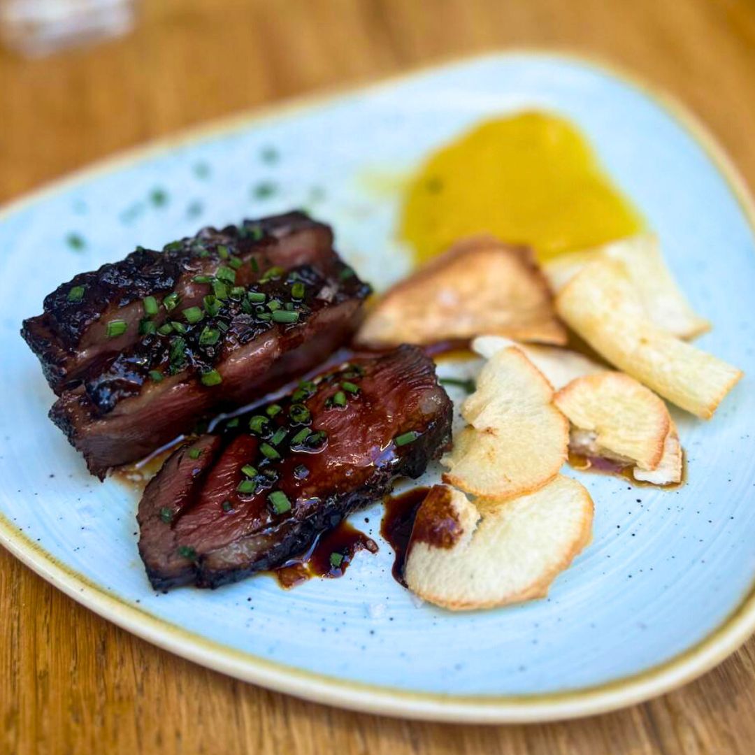 A plated and sliced Seared Duck Breast, Sirimiri restaurant, San Sebastiàn