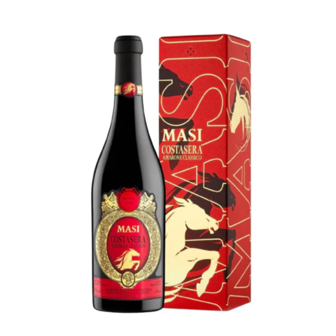 A black bottle of wine with a red and yellow label next to a red rectangular box.