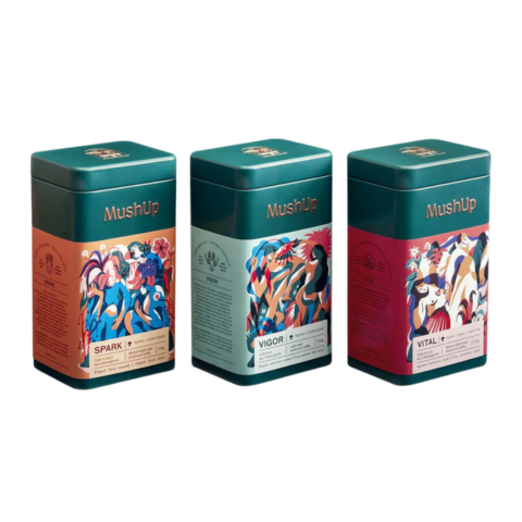 Three green coffee cans of mushroom coffee.