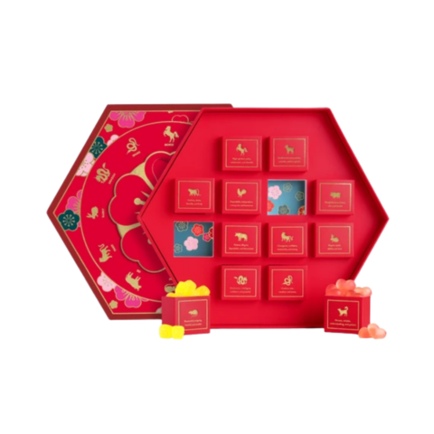 A red hexagonal box featuring 12 mini pull-out boxes with candy inside each one.
