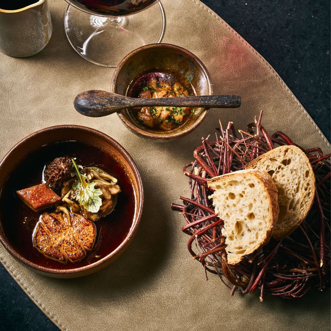 Duck course at Tanière3 showcasing Quebec terroir with refined plating and rustic elements