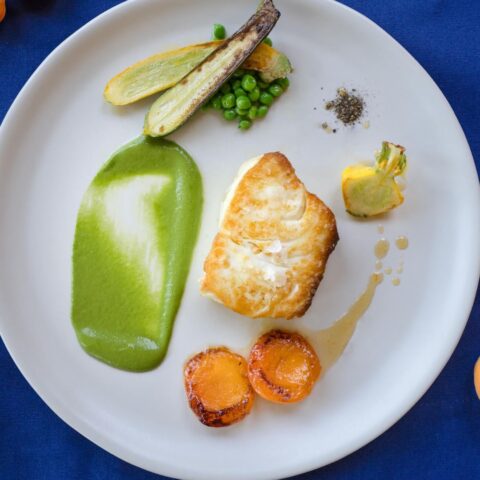 Grilled Halibut and Apricot on a white plate