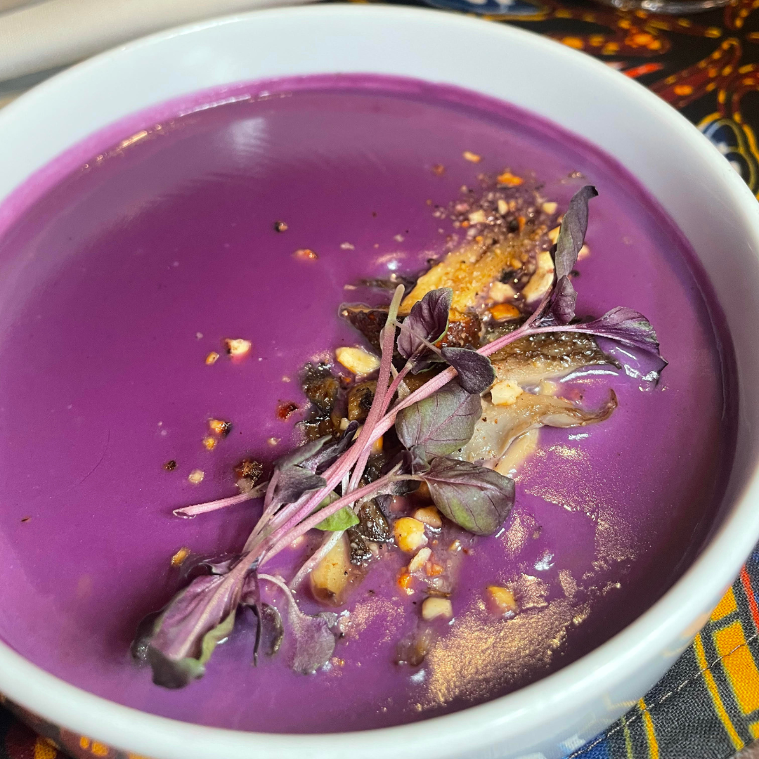 A bowl of purple soup.