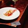 American Express Diners Card sitting next to fine dining meal