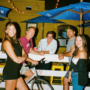 Group of attractive people standing outside Penny's patio in toronto