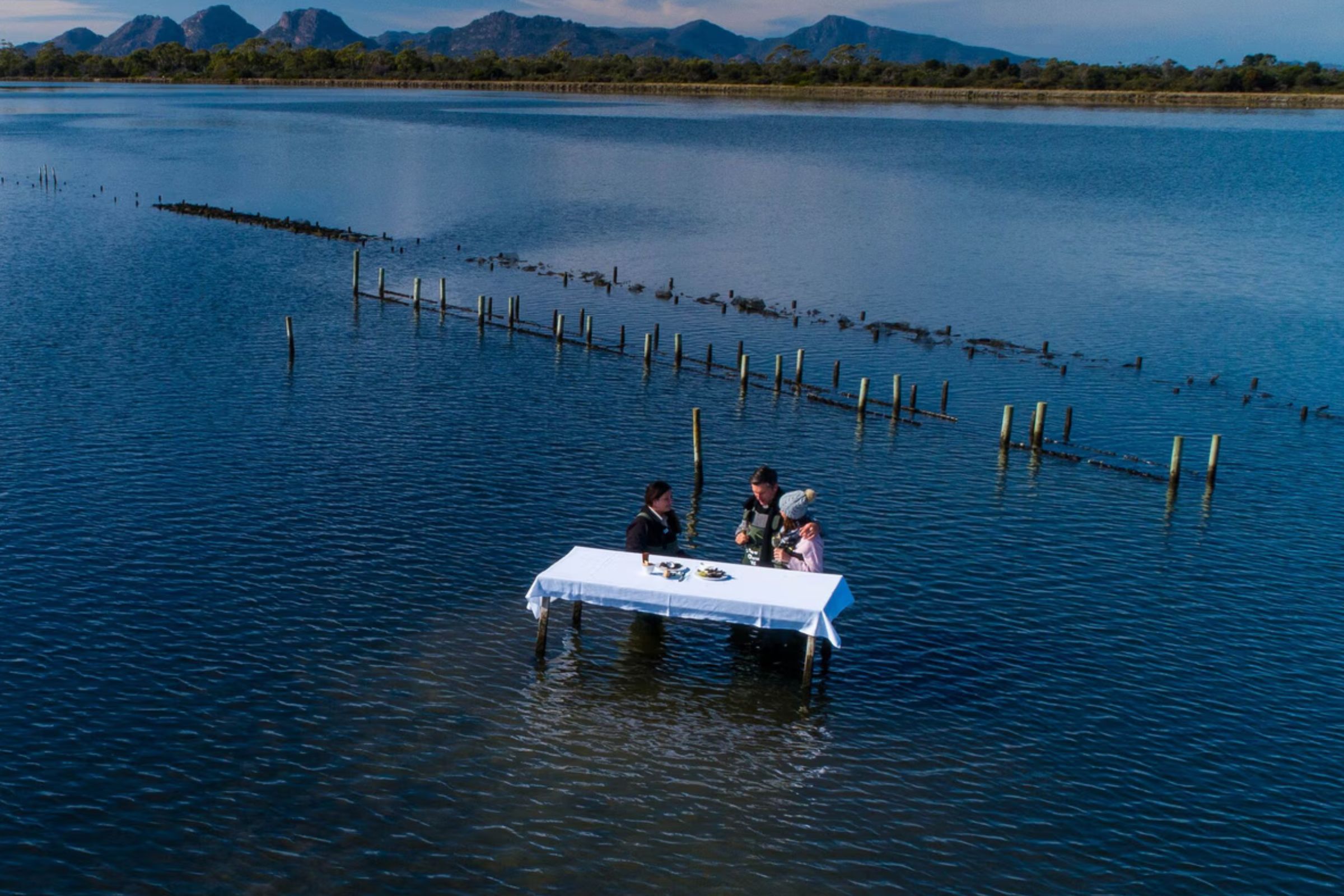 Couple enjoying oysters at a luxury hotel in Tazmania
